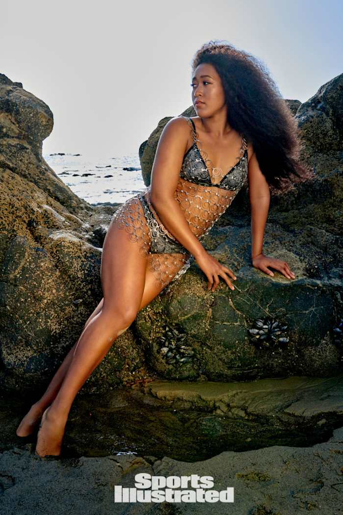 Naomi Osaka was photographed by Yu Tsai in Malibu, Calif. Swimsuit by Louis Vuitton x Naomi Osaka. Dress by Michael Schmidt. Earrings by Ana Khouri.